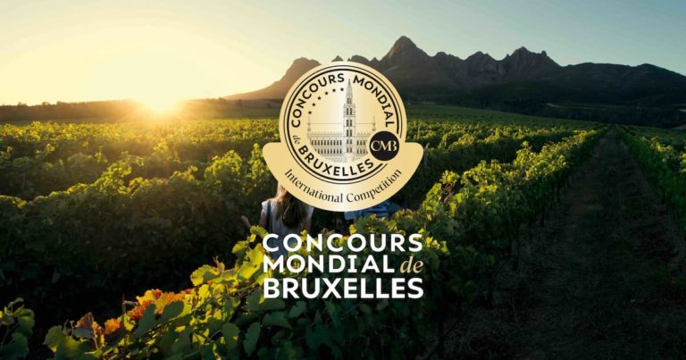 A picture of wine vines with the CMB Medal centered on the image